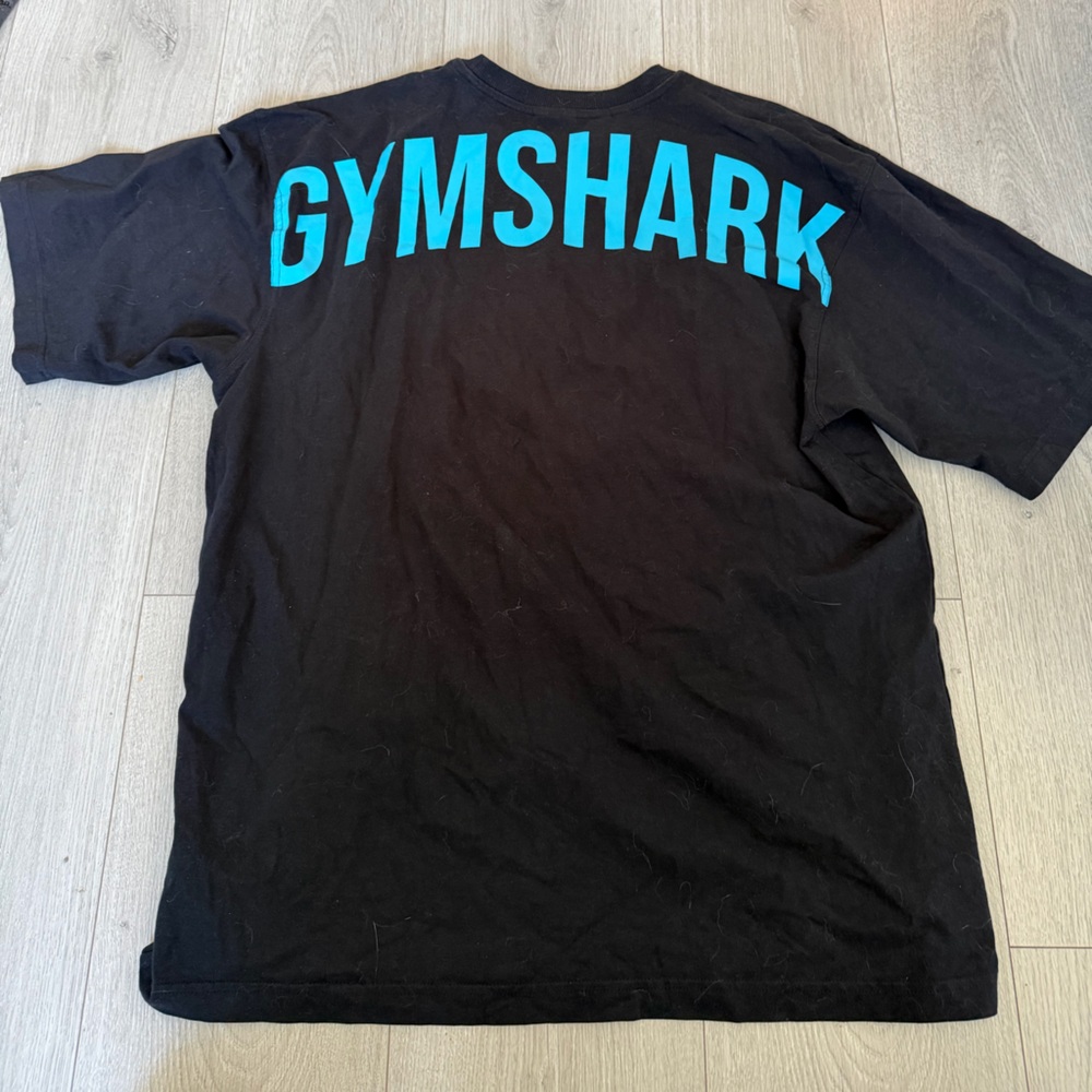 Gymshark Black Oversized Tee with Vibrant Blue Lettering